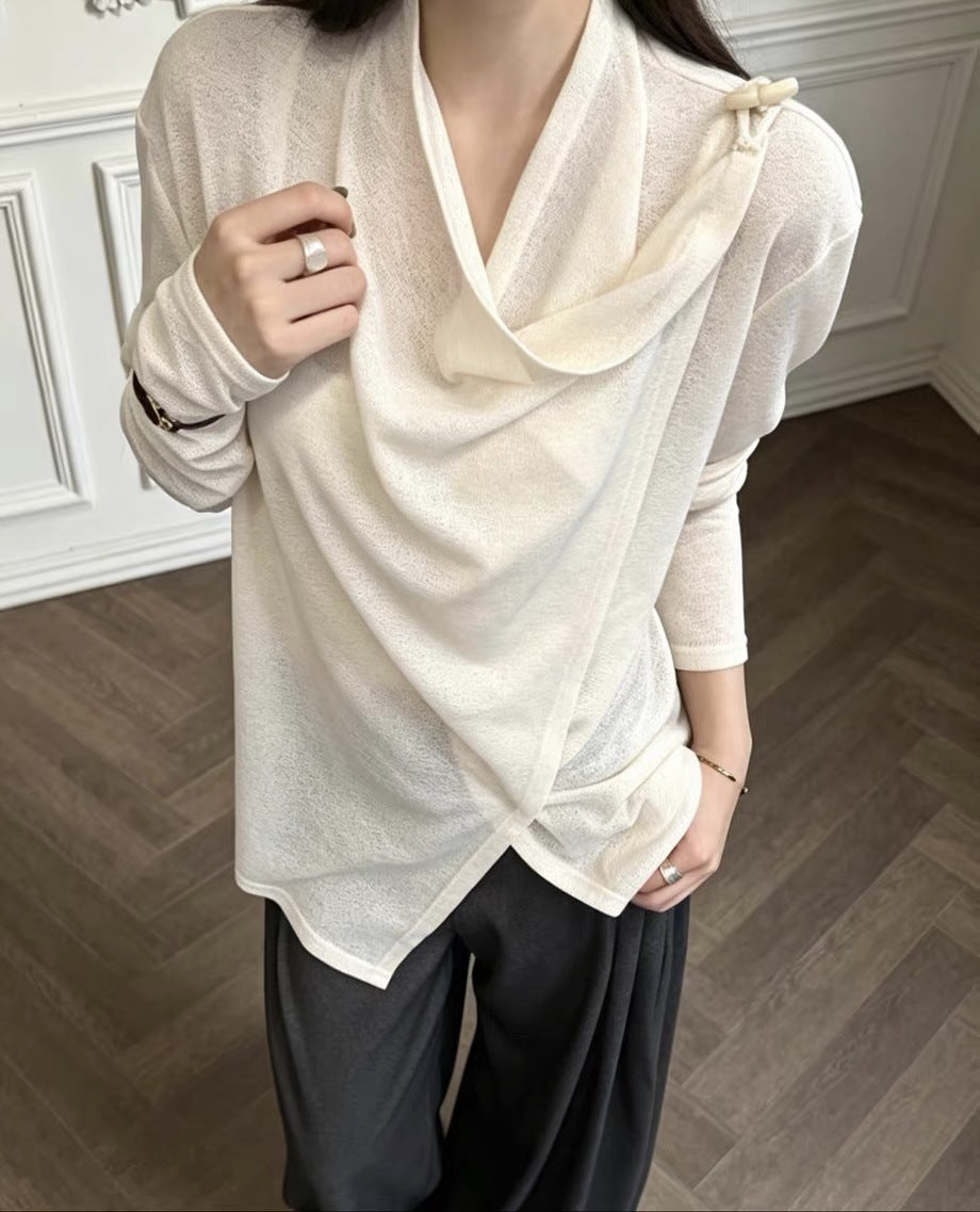 Cream draped knit top on model