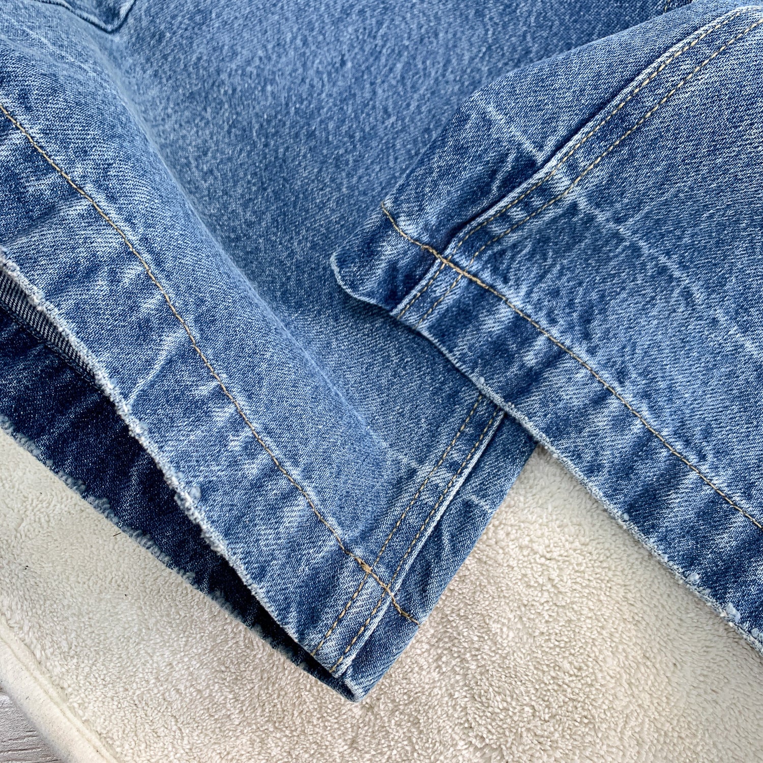 Washed flare denim leg opening detail | ZIRR